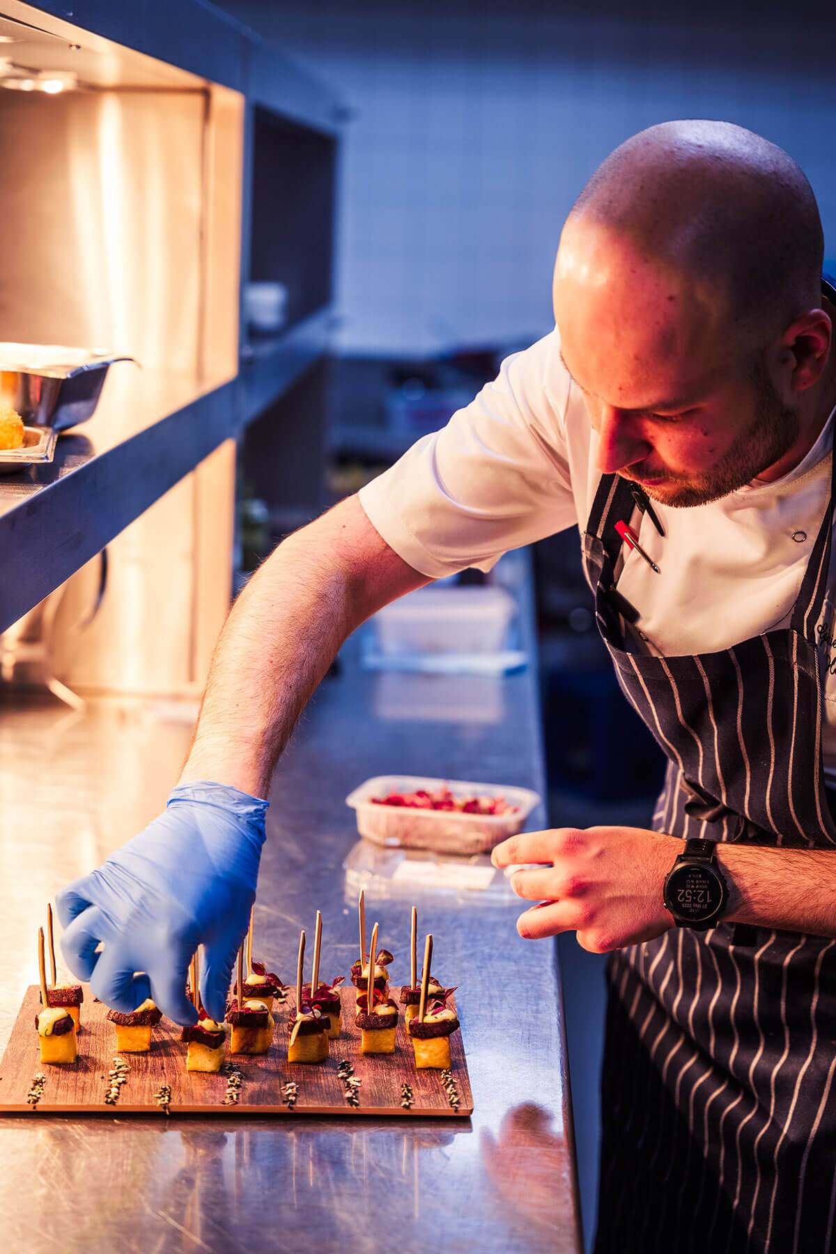 Chef preparing canapés by Seasoned catering